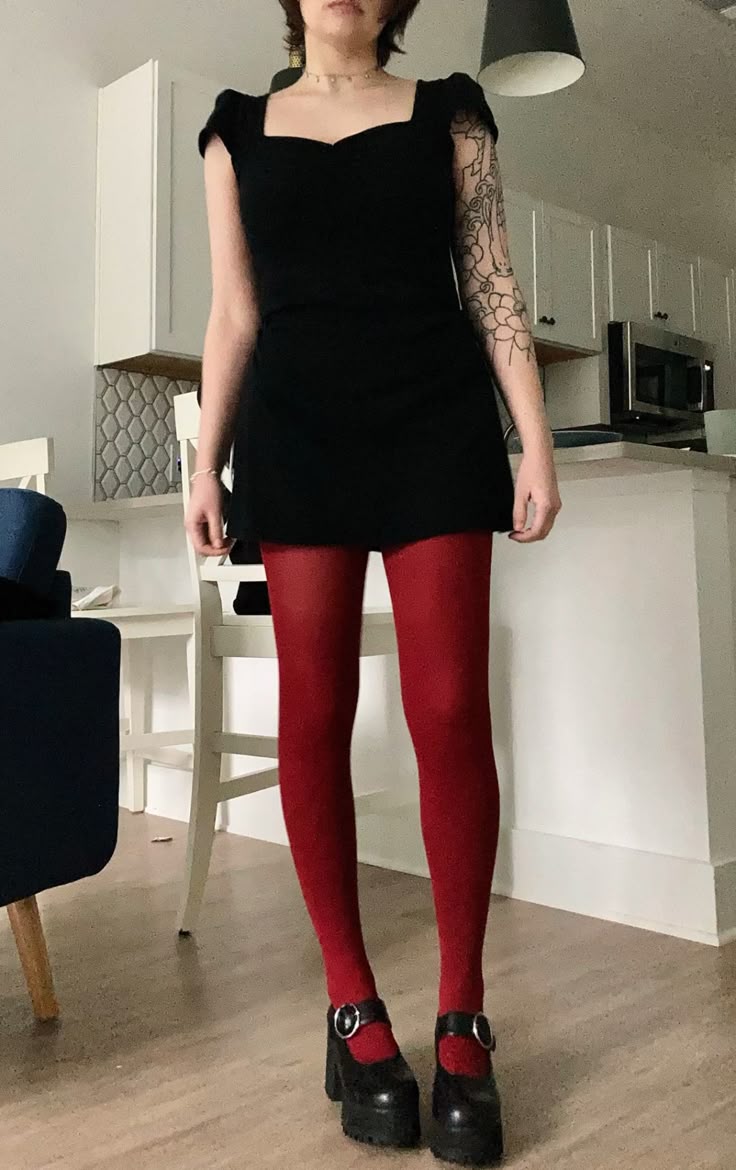 Black mini dress with red tights